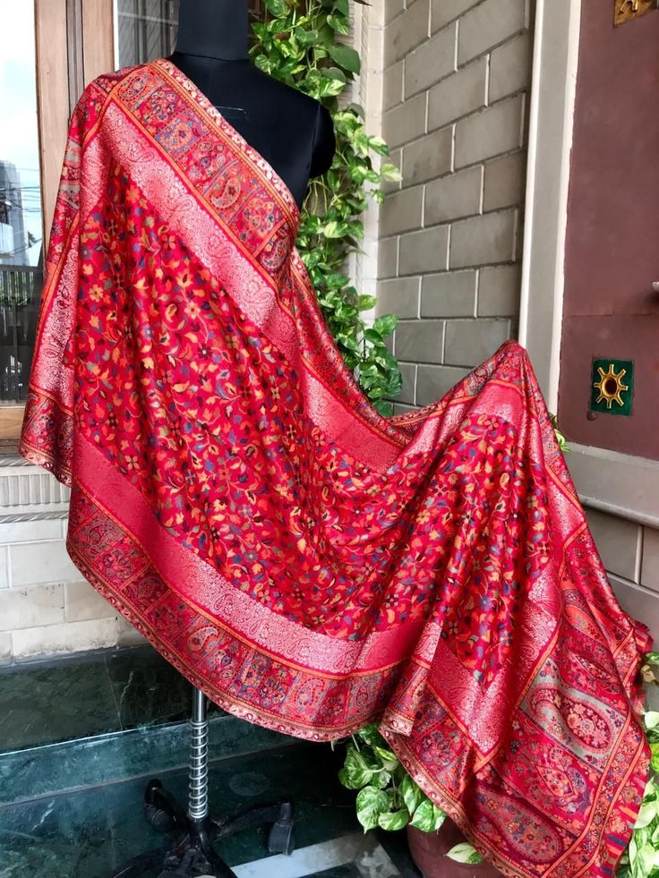 Red embroidered pashmina shawl with traditional floral motifs and ornate border design  handcrafted luxury wrap